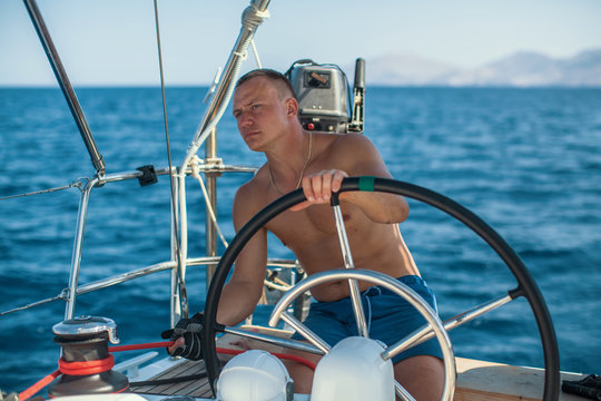 Yachtsman during in the race, sailing the Aegean sea.