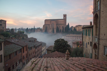 Basilica Cateriniana or Basilica of San Domenico in the mist, Siena, Tuscany, Italy.