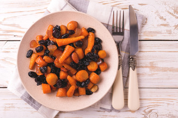 Jewish Tzimmes dessert with carrot, raisins and dried fruits