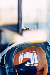 Fototapeta na wymiar Gold wedding rings on a motorcycle helmet