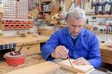 senior craftsman in his workshop