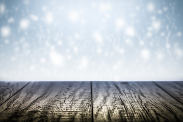 Winter background scene with wooden desk.