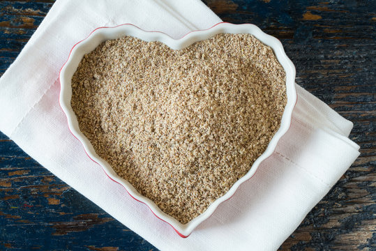 Ground Flaxseed in a Heart Shaped Bowl