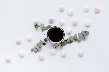 sweet lunch with marsh-mallow and spring flowers for woman on white background top view