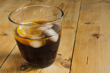 Cola with lemon and ice