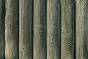 Wooden fence of round logs