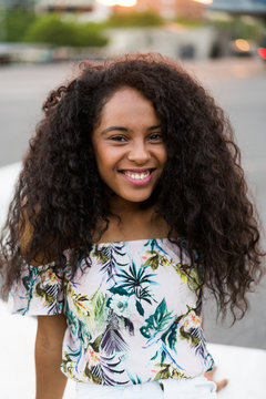 Young black woman smiling and looking at camera