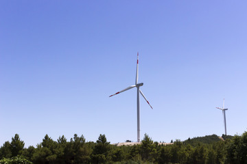 Fototapeta na wymiar Wind turbines generating renewable wind energy