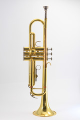 This is a photo of a trumpet on a white background. 