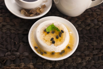 Panna cotta dessert with passion fruit and mint