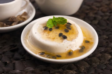 Panna cotta dessert with passion fruit and mint