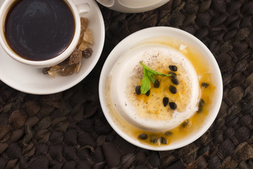 Panna cotta dessert with passion fruit and mint