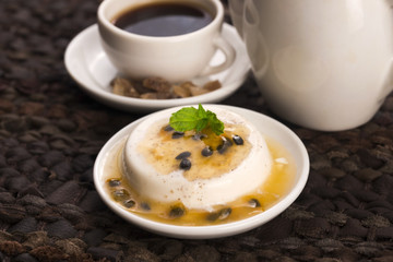 Panna cotta dessert with passion fruit and mint