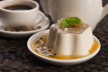 Panna cotta dessert with passion fruit and mint