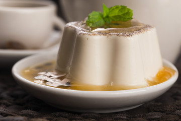 Panna cotta dessert with passion fruit and mint