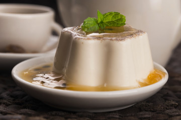 Panna cotta dessert with passion fruit and mint
