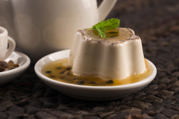 Panna cotta dessert with passion fruit and mint