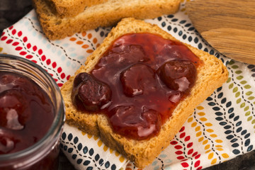 Breakfast of cherry jam on toast