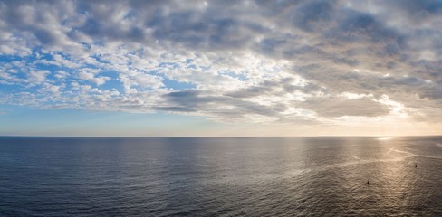 Sea and the cloudy sky