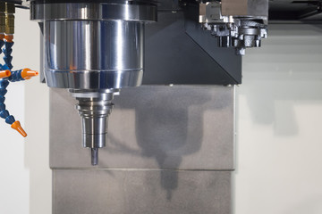 The CNC milling machine cutting the sample part with the small end-mill in light blue scene.Hi-precision CNC machining concept.