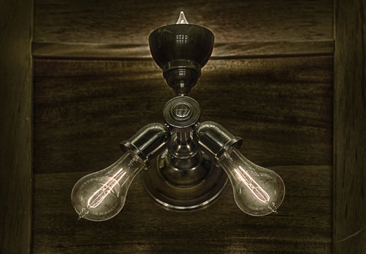 An original,classic or vintage lamp with turn of the century light bulbs illuminated from a financial institution trading floor