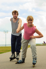 roller skater couple skating outdoor