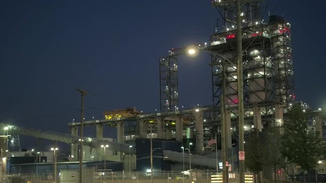 CLOSE UP Stunning modern fossil fuel power plant station using natural gas to produce electricity. Steel pipelines and construction frame in new gasworks. Industrial factory for the production of heat