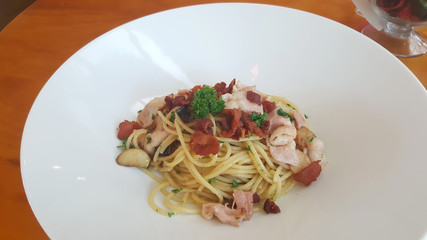 Bacon spaghetti on white plate