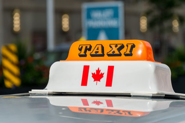 Close up of a taxi roof sign in Toronto, Canada