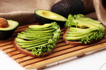 Sandwich with avocado - healthy breakfast concept