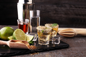 Selection of alcoholic drinks on rustic stone plate