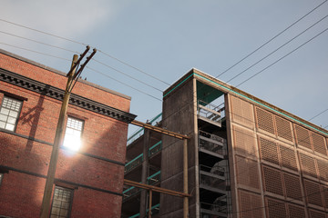 Photo of Downtown Vancouver buildings and energy cables against blue sky, BC
