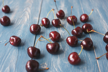 Berries of ripe cherries on a wooden background.
