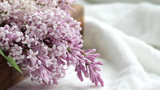 Close-up of lilac flowers in a wooden dox. Wedding concept.