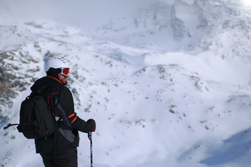 Fototapeta na wymiar Skiing: male skier in powder snow. Italian Alps, Europe.