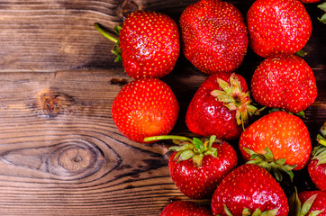 Ripe strawberries on wooden table. Top view