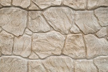 New decorative plaster imitating a stone wall