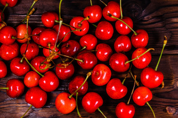 Fresh ripe cherries on wooden table. Top view