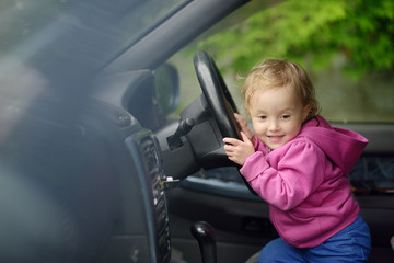 The little girl driving the car