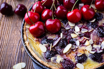 Sweet cherry tart in rustic cast iron skillet