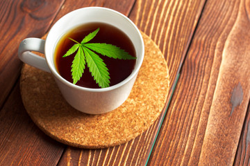 Cannabis herbal tea and marijuana leaves