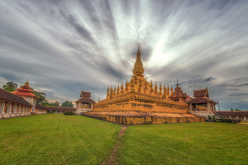 Laos travel landmark, golden pagoda wat Phra That Luang in Vientiane, Buddhist temple, Religious architecture and landmarks, Famous tourist destination in Asia.