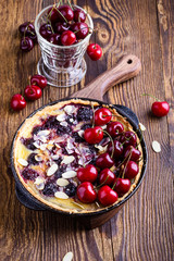 Sweet cherry tart in rustic cast iron skillet