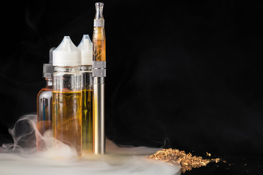 Electronic cigarette with bottles and grinded tobacco leaves