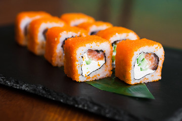 Delicious rolls with fish and cheese	