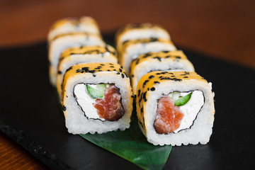 Delicious rolls with fish and cheese	