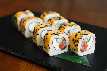 Delicious rolls with fish and cheese	