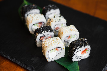 Delicious rolls with fish and cheese	