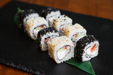 Delicious rolls with fish and cheese	