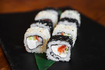 Delicious rolls with fish and cheese	